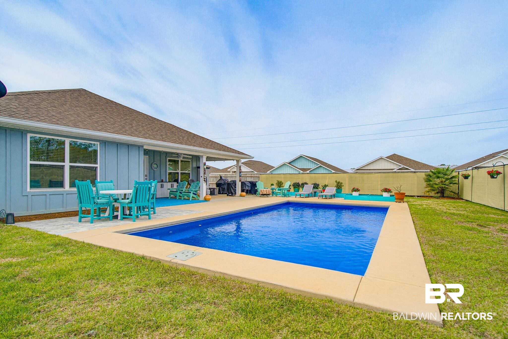 261 Fulham Lane Foley, AL 36535 - Photo 45 of 50 View of swimming pool with patio surround, a fenced backyard, and outdoor lounge area