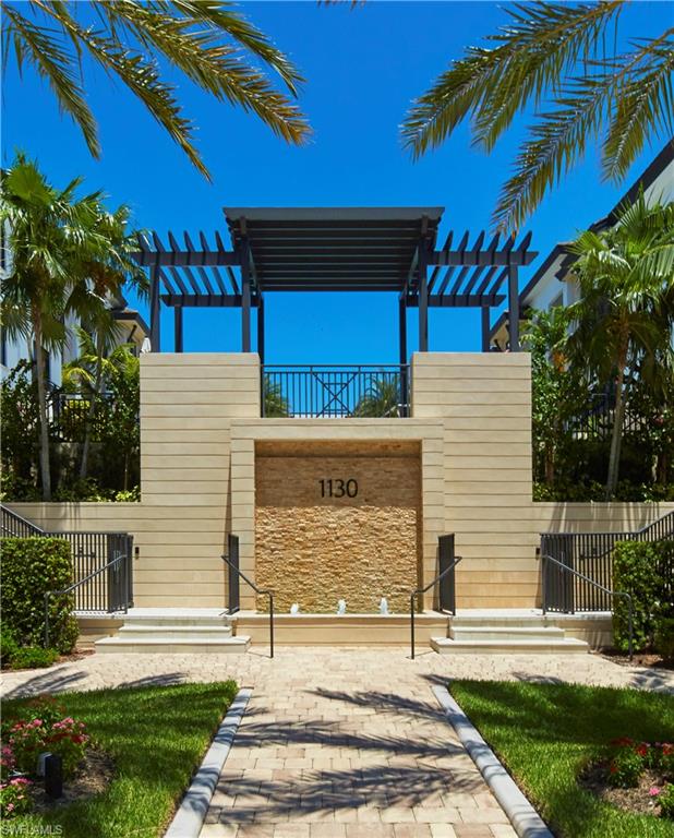 1130 3rd Avenue South, Unit 508 Naples, FL 34102 - Photo 4 of 4 a front view of a house with a yard