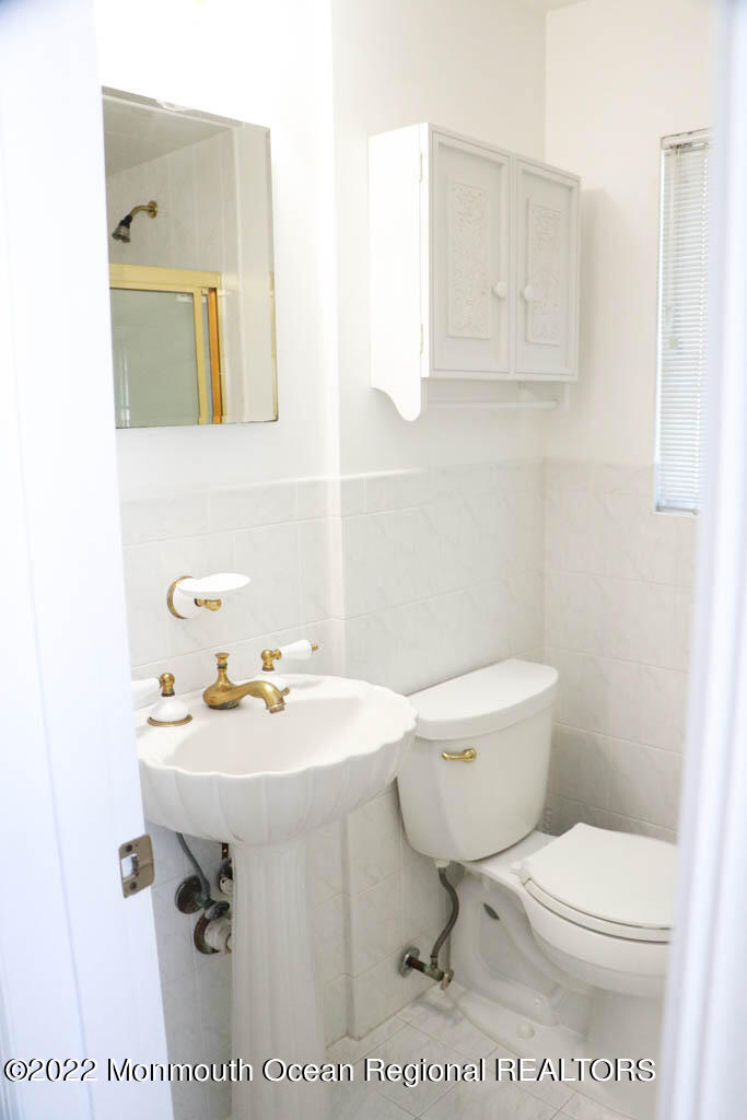 5 Vine Court Long Branch, NJ 07740 - Photo 12 of 30 a bathroom with a sink toilet and mirror
