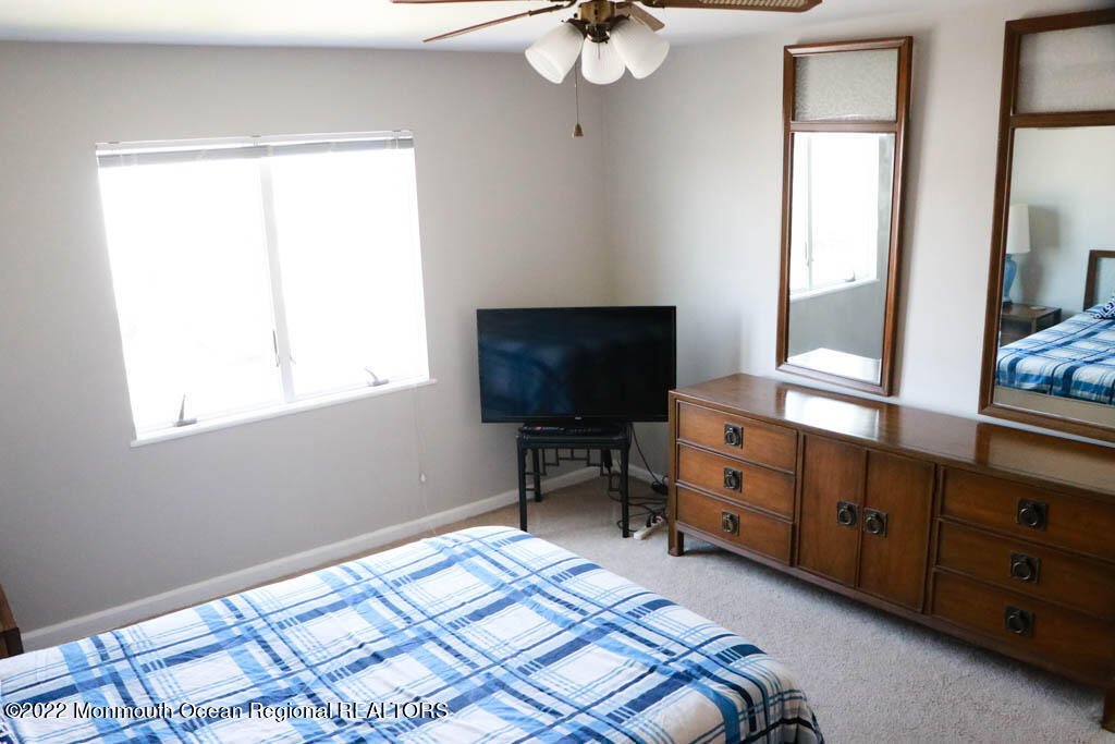 5 Vine Court Long Branch, NJ 07740 - Photo 17 of 30 a bedroom with a bed and a television