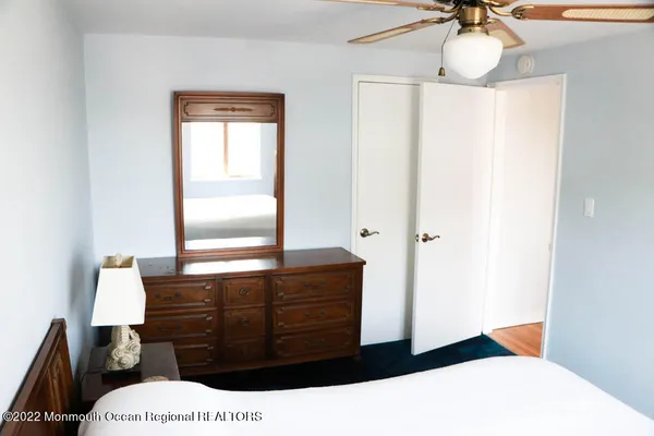 a bathroom with a sink a mirror and a shower