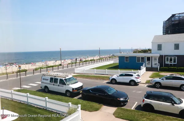 a front view of a house with swimming pool having outdoor seating