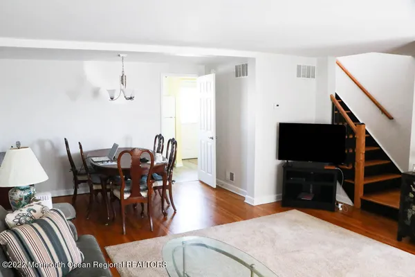 a view of a livingroom with furniture and wooden floor