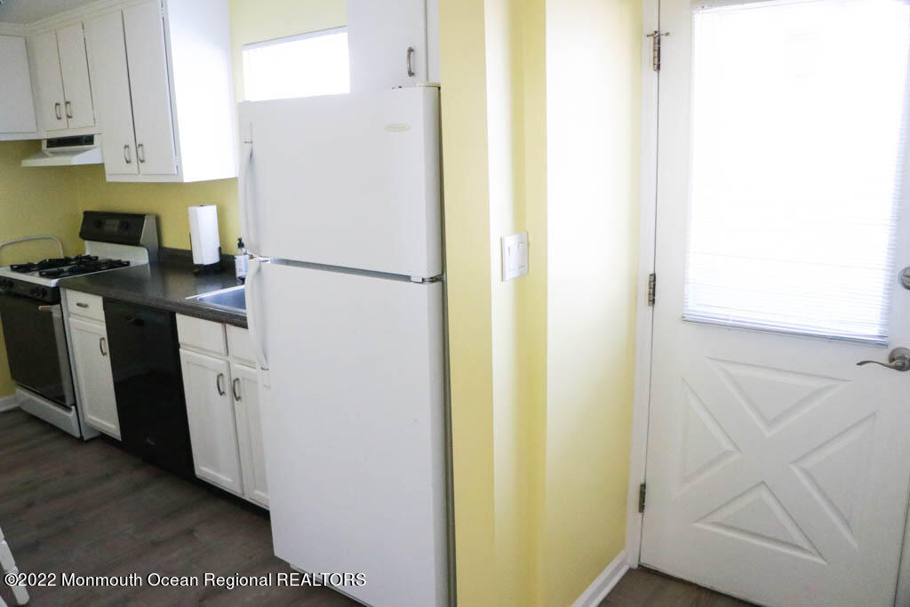 5 Vine Court Long Branch, NJ 07740 - Photo 7 of 30 a white refrigerator freezer sitting inside of a kitchen