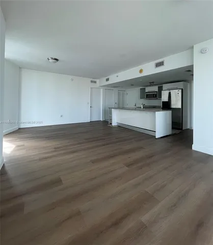a view of a livingroom with wooden floor