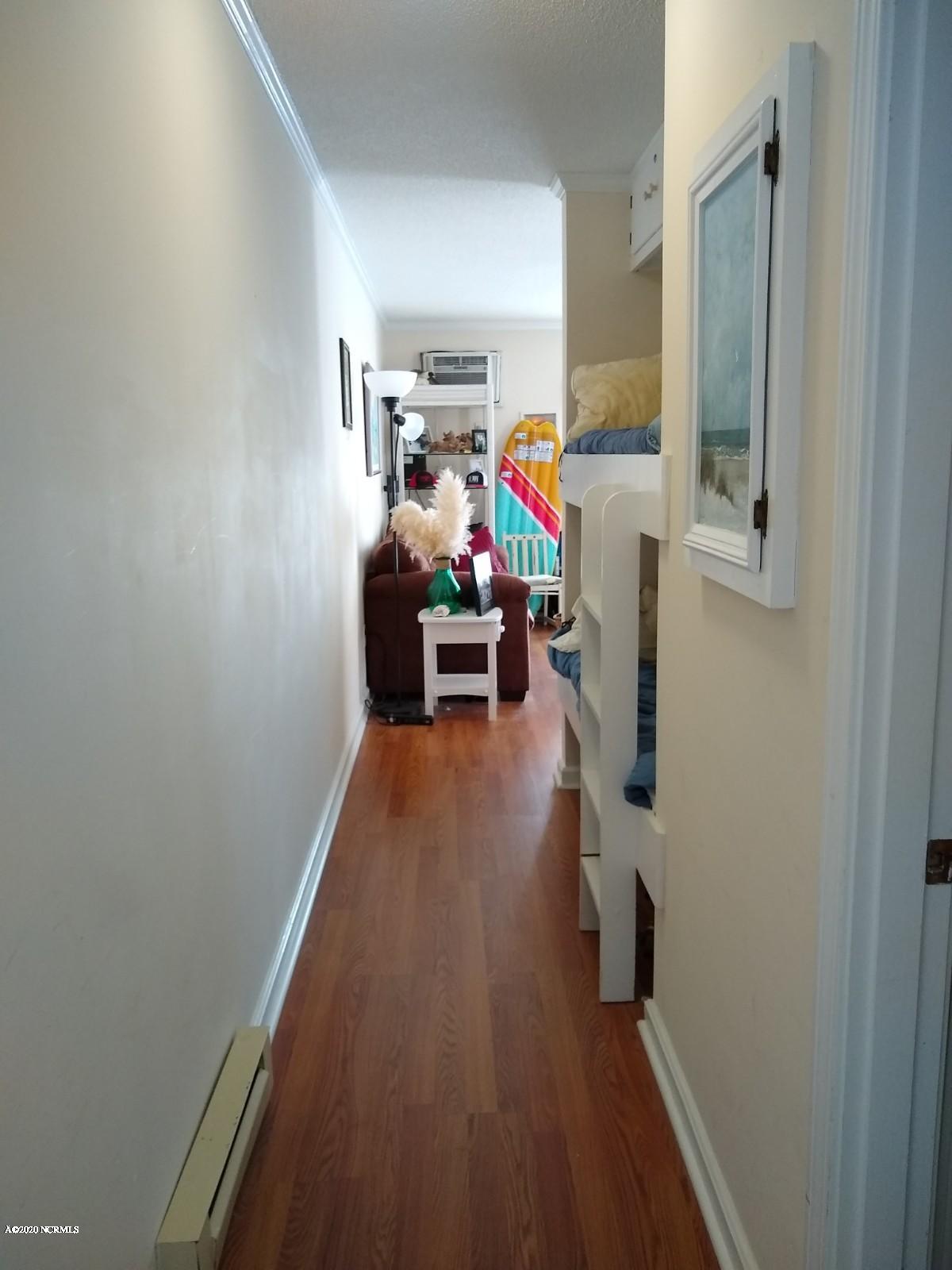 2182 New River Inlet Road, Unit 279 North Topsail Beach, NC 28460 - Photo 18 of 22 Hallway view into living room