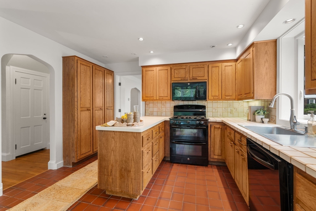 16 Duxbury Road Newton, MA 02459 - Photo 14 of 30 a kitchen with stainless steel appliances granite countertop a stove top oven a sink dishwasher and a refrigerator