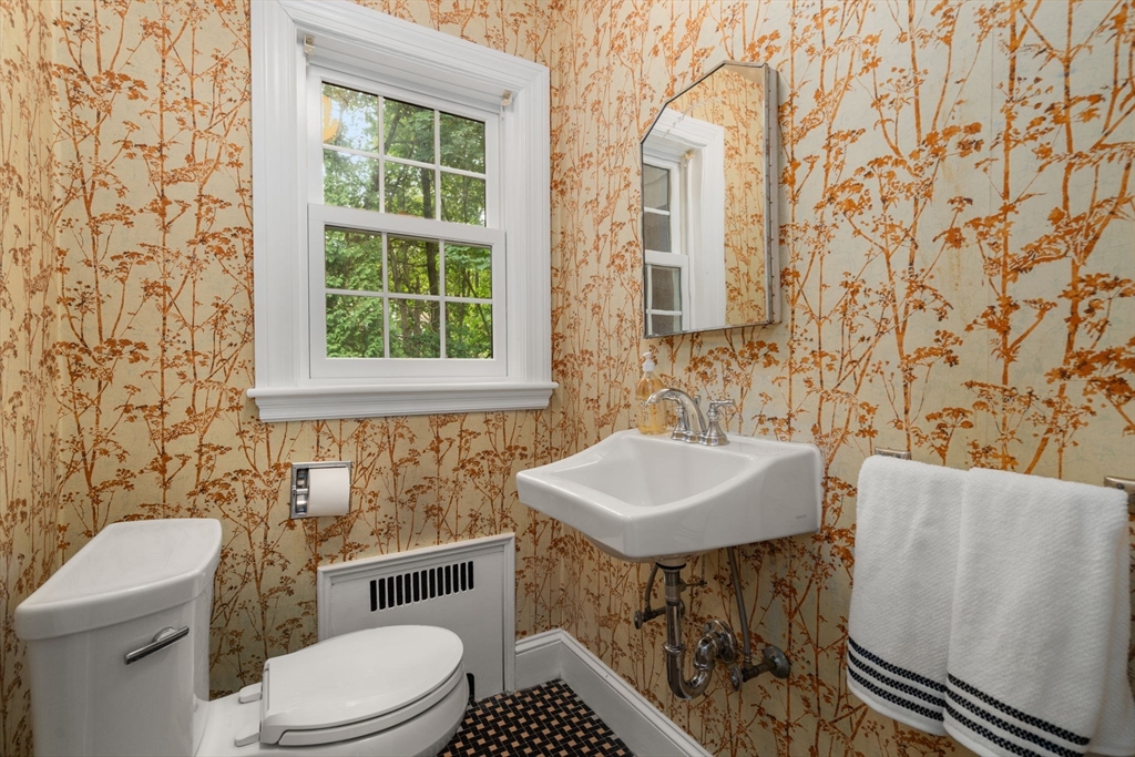 16 Duxbury Road Newton, MA 02459 - Photo 20 of 30 a bathroom with a sink a toilet and a mirror