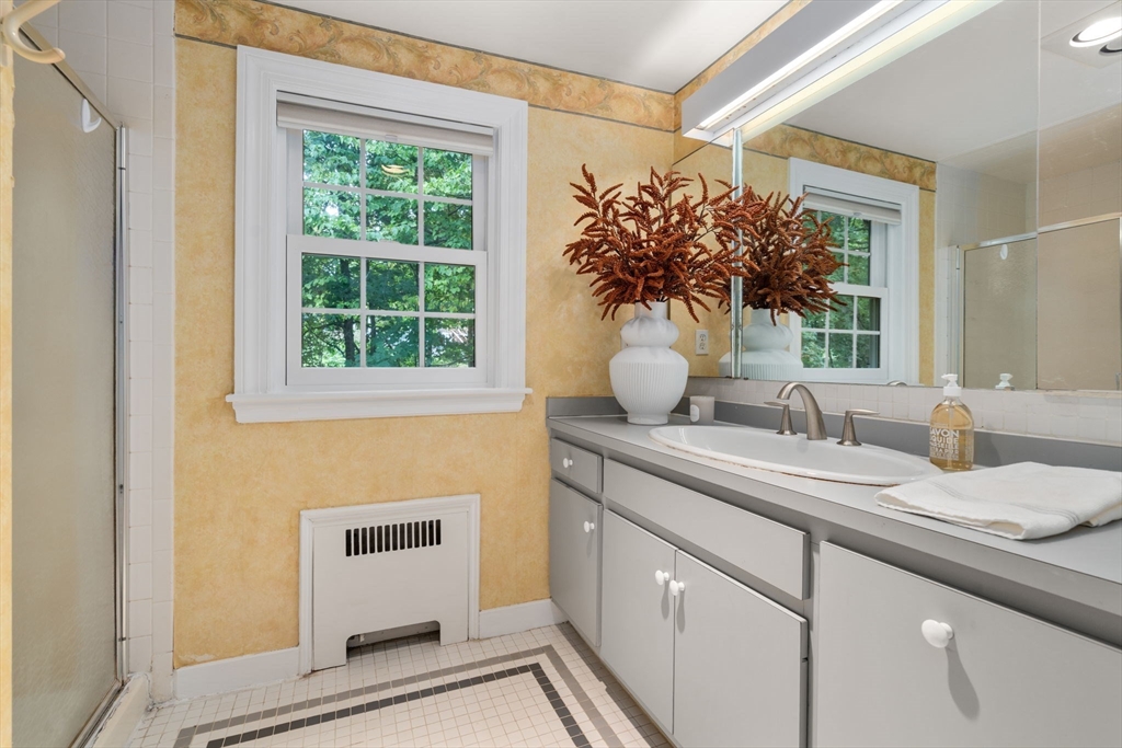 16 Duxbury Road Newton, MA 02459 - Photo 23 of 30 a bathroom with a sink and a mirror