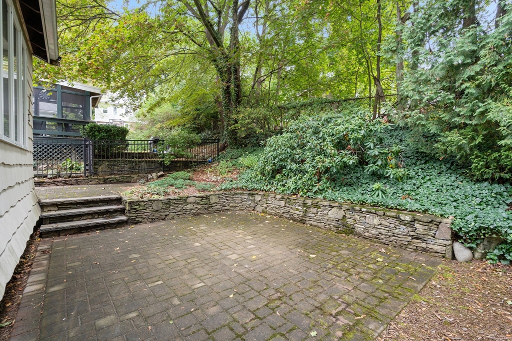 16 Duxbury Road Newton, MA 02459 - Photo 28 of 30 a backyard of a house with lots of green space
