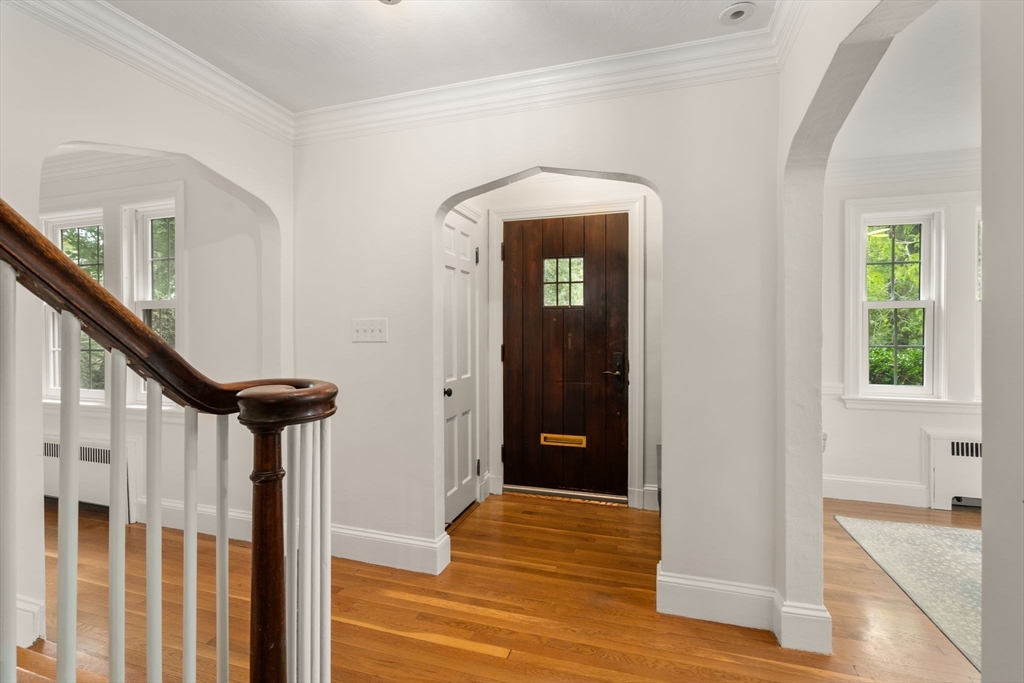 16 Duxbury Road Newton, MA 02459 - Photo 3 of 30 a view of a hallway with wooden floor and stairs