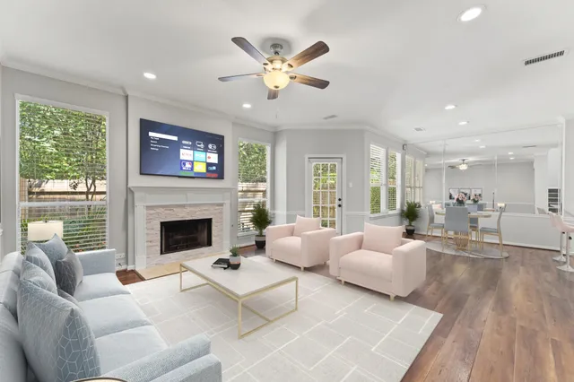 a living room with furniture fireplace and window
