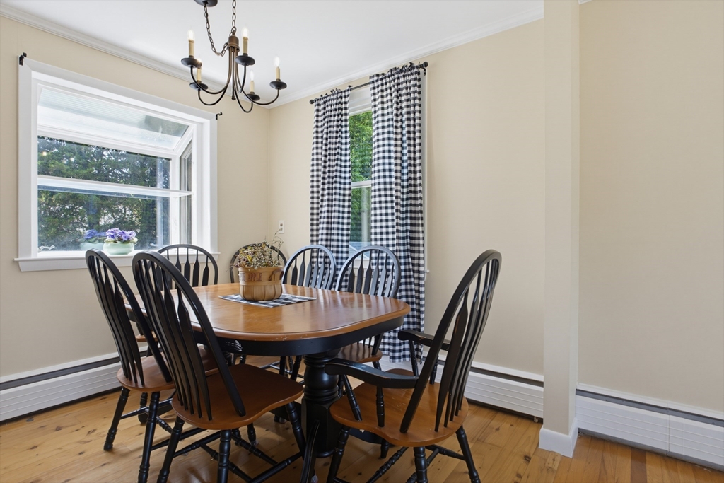 433 Pearse Road Swansea, MA 02777 - Photo 9 of 40 a view of a dining room with furniture window and wooden floor