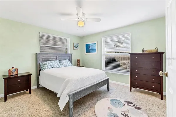 a bedroom with a bed and a dresser