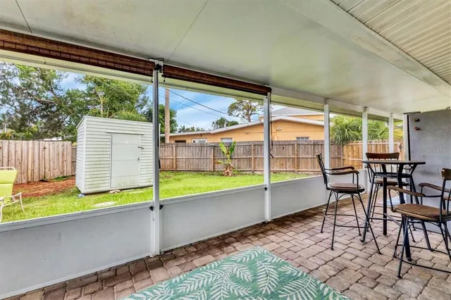a view of a swimming pool with a porch