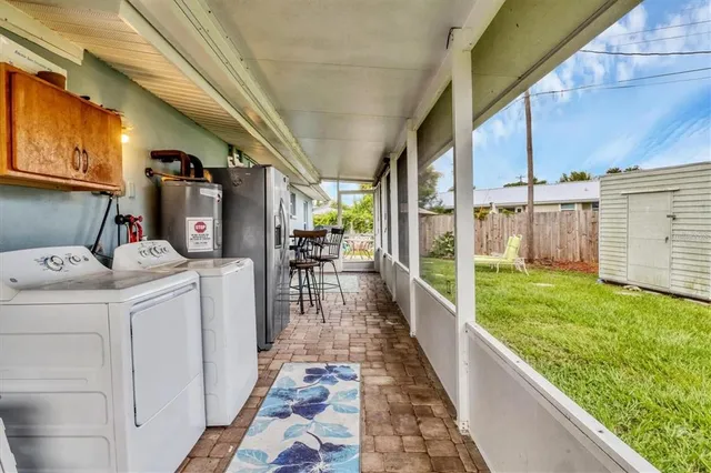a view of a porch with wooden floor