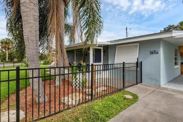a view of a wrought iron fences in front of house