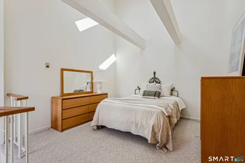 a bed room with a bed and a window