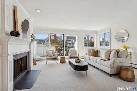 a living room with furniture fireplace and a fireplace