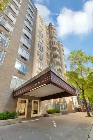 a bathroom with a sink toilet vanity and shower