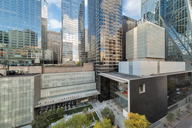 a view of a kitchen with a sink and a fireplace