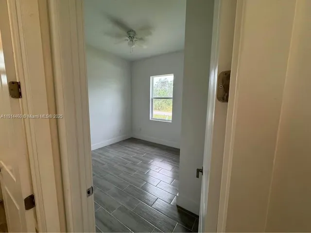 a view of an empty room and window