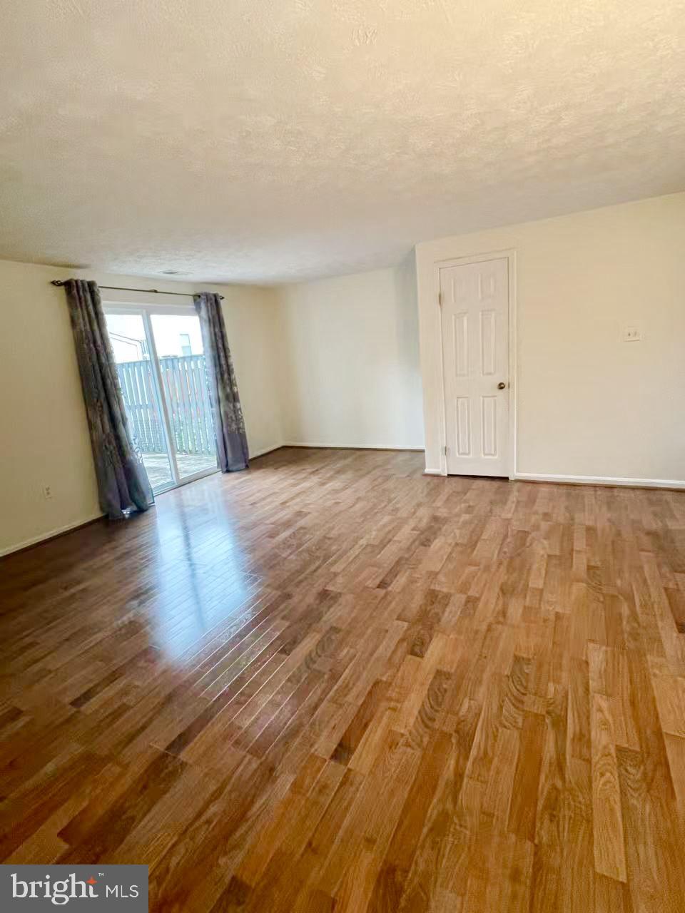6712 Quiet Hours Columbia, MD 21045 - Photo 21 of 38 a view of an empty room and wooden floor