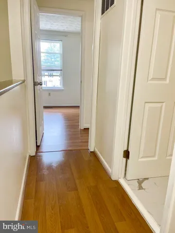 a bathroom with a toilet and shower