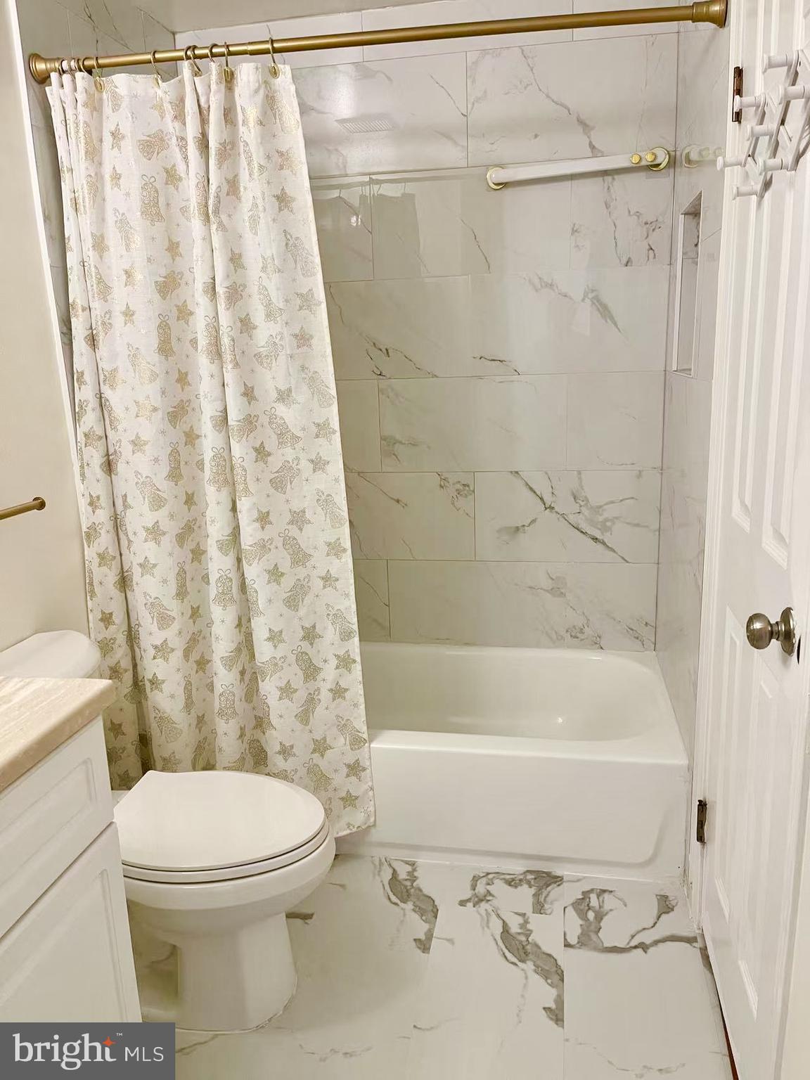 6712 Quiet Hours Columbia, MD 21045 - Photo 28 of 38 a bathroom with a toilet and shower