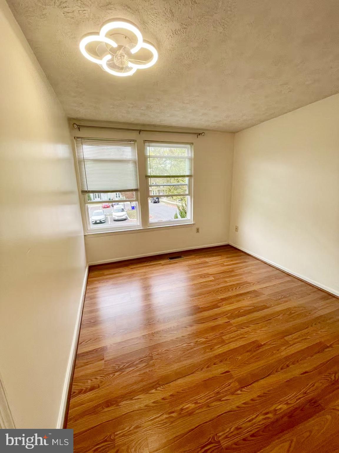 6712 Quiet Hours Columbia, MD 21045 - Photo 35 of 38 an empty room with wooden floor and windows