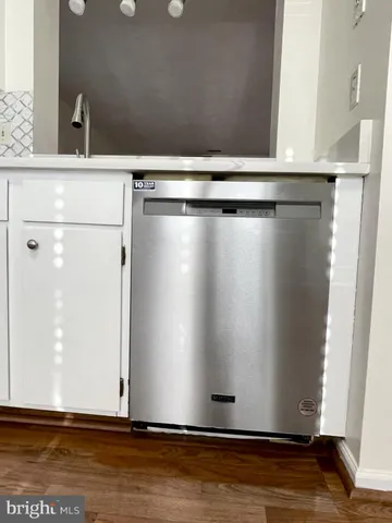 a view of room with wooden floor