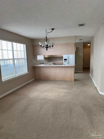 a view of kitchen and windows