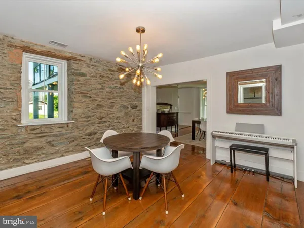a kitchen with stainless steel appliances granite countertop a sink and a refrigerator