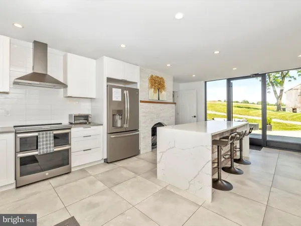 a spacious bedroom with a large bed and a couch