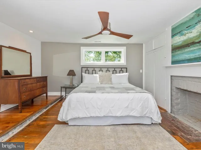a bedroom with two beds and a chandelier