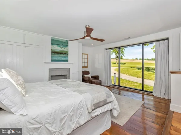 a bedroom with two beds and a window