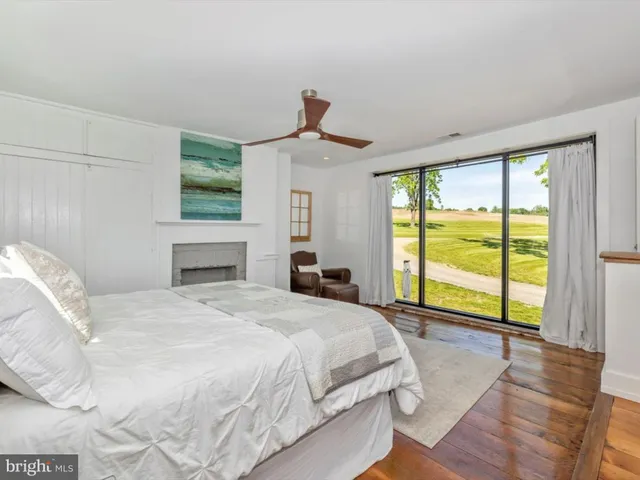 a bedroom with two beds and a window