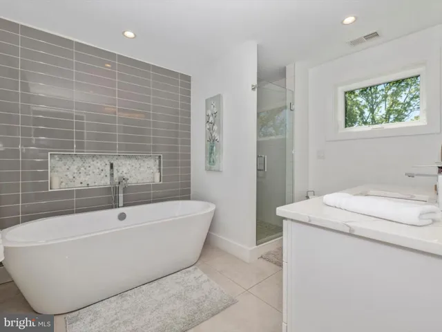 a balcony with chairs and wooden floor