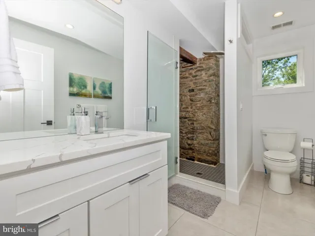 a view of a patio with table and chairs and wooden floor