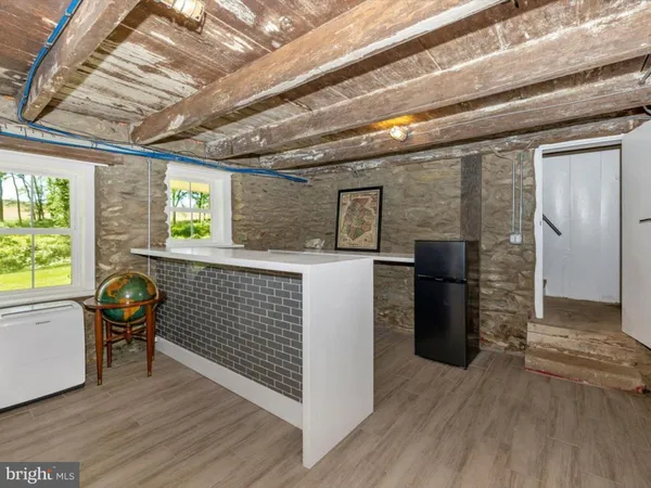 a view of living room with furniture and window