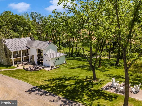 a view of house with outdoor space and garden