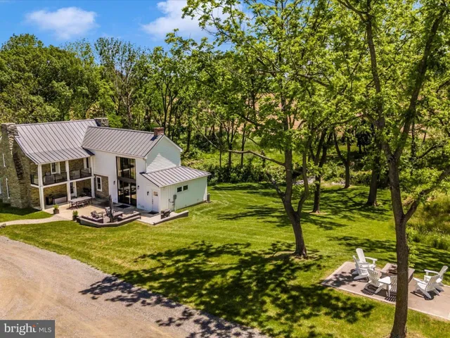 a view of house with outdoor space and garden