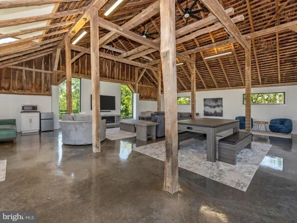 a view of a house with a yard porch and sitting area