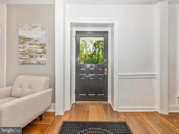 a living room with furniture rug and window