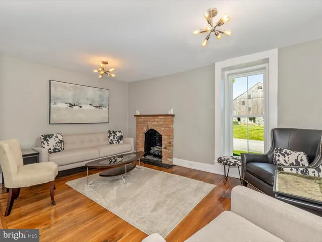 a view of a dining room with furniture and window