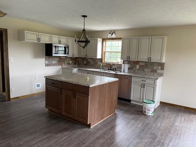 370 Walnut Grove Road Bolivar, TN 38008 - Photo 7 of 16 a kitchen with a sink cabinets and wooden floor