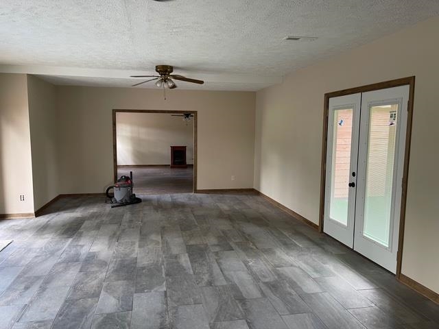 370 Walnut Grove Road Bolivar, TN 38008 - Photo 9 of 16 a view of a livingroom with a fireplace