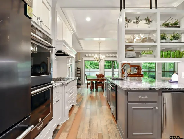 a kitchen with granite countertop lots of counter top space