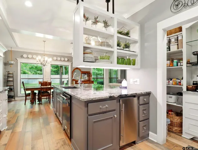 a kitchen with a sink and cabinets