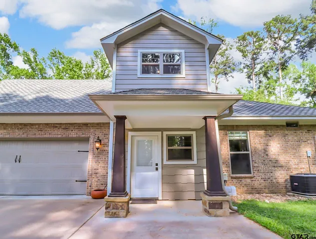 a view of a patio with a dining table and chairs